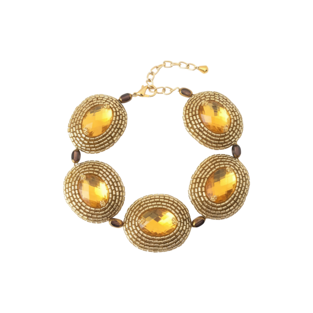 Pulseira artesanal Iluztro dourada com cristais âmbar – missangas bordadas à mão